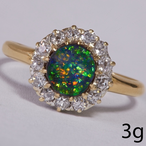 56 - BLACK OPAL AND DIAMOND CLUSTER RING.
3 grams, testing 18 ct. gold.
Set with black opal with a good p... 