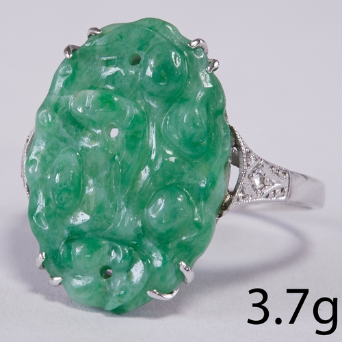 84 - ART-DECO JADE AND DIAMOND RING,
3.7 grams, testing 14 ct. gold.
Carved jade plaque.
Size O 1/2.