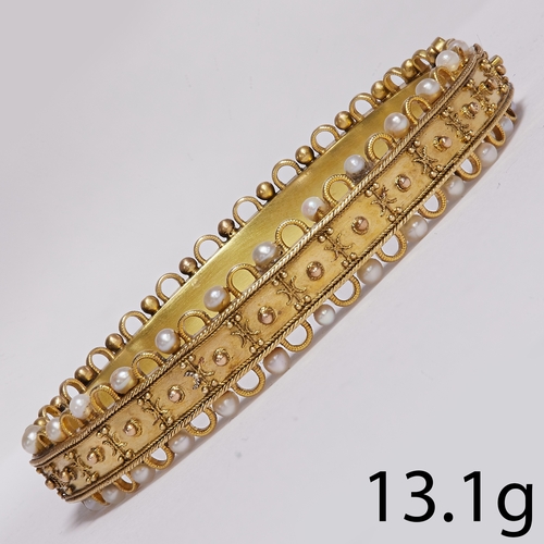 64 - A LOVELY VICTORIAN GOLD BANGLE.
13.1 grams.
Set with seed pearls and all is present.
A lovely  workm... 