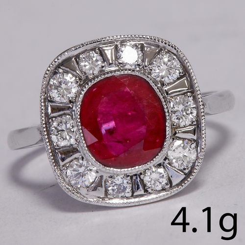 13 - RUBY AND DIAMOND CLUSTER RING.
4.1 grams, high carat gold.
Vibrant rich  ruby of approx. 1.75 ct.
Di... 