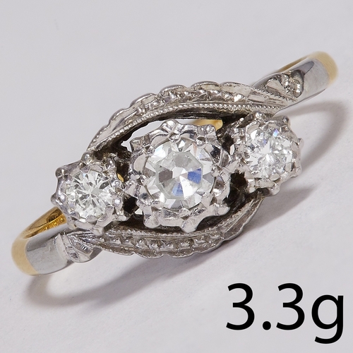 17 - DIAMOND  3-STONE CROSSOVER RING,
3.3 grams, 18 ct. gold and platinum.
Diamonds bright and lively.
Si... 