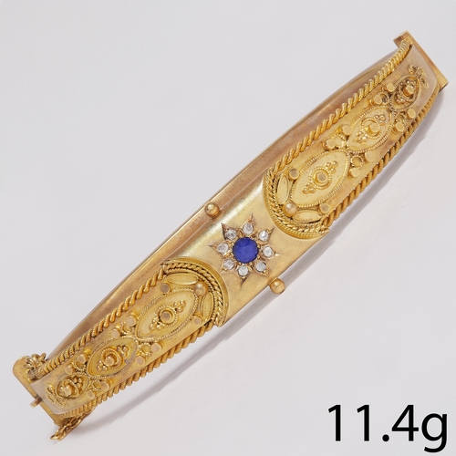 31 - VICTORIAN GOLD SAPPHIRE AND DIAMOND HINGED BANGLE 
11.4 grams 
detailed filigree work 
vibrant sapph... 