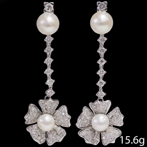 139 - FINE PAIR OF PEARL AND DIAMOND DROP EARRINGS,
15.6 grams, high carat gold.
The top set with a larger... 