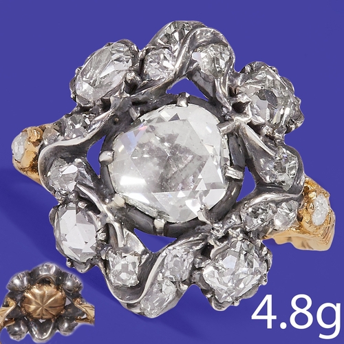 169 - ANTIQUE DIAMOND CLUSTER RING,
4.8 grams.
Large rose cut diamond to the center of approx. 7.1 x 7 mm.... 