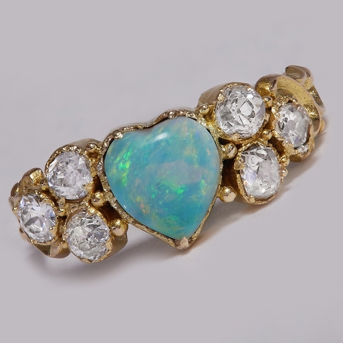185 - ANTIQUE OPAL AND DIAMOND RING,
2.1 grams, testing 14 ct. gold.
The opal with a good play of colour.
... 