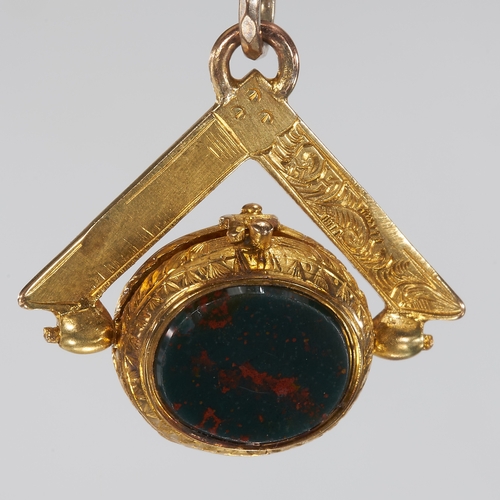 224 - UNUSUAL MASONIC SWIVEL FOB GOLD PENDANT,
6.3 grams.
The swivel part can open.
One side with bloodsto... 
