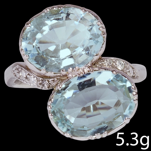 107 - AQUAMARINE AND DIAMOND TOI ET MOI RING,
5.3 grams, high carat gold.
Vibrant aquamarines, totalling a... 