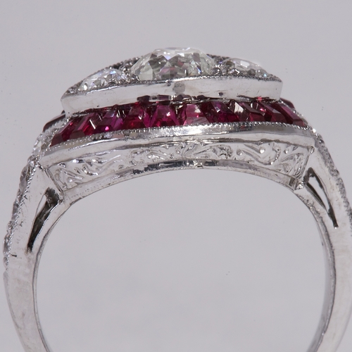 131 - RUBY AND DIAMOND CLUSTER RING,
3.8 grams, 18 ct. gold.
Gemstones totalling approx. 1.50 ct.
Diamonds... 