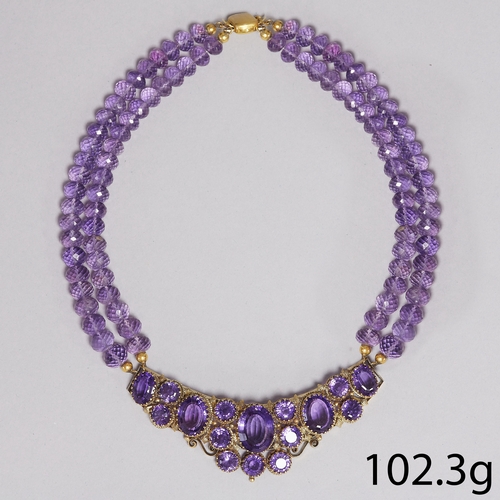 148 - VIBRANT AMETHYST DOUBLE ROW NECKLACE,
102.3 grams.
Center section with right and vibrant amethyst.
T... 