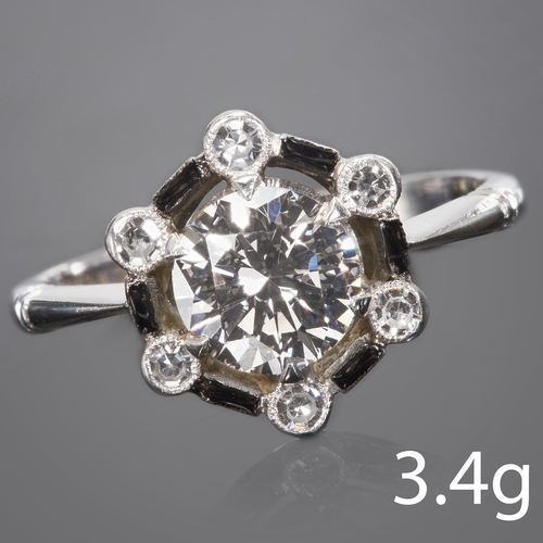 151 - UNUSUAL DIAMOND CLUSTER RING,
3.4 grams, 18 ct. gold and platinum.
Central bright and lively diamond... 