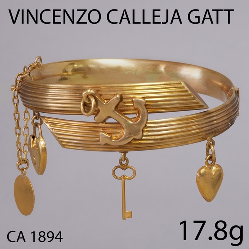 57 - A HINGED CHARM BANGLE, POSSIBLY BY VINCENZO CALLEJA GATT CIRCA 1894
17.8 grams, testing 15 ct. gold.... 