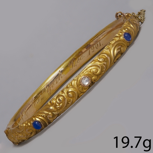 70 - EDWARDIAN AMETHYST AND DIAMOND HINGED BANGLE,
19.7 grams, testing high carat gold.
Fine high relief ... 