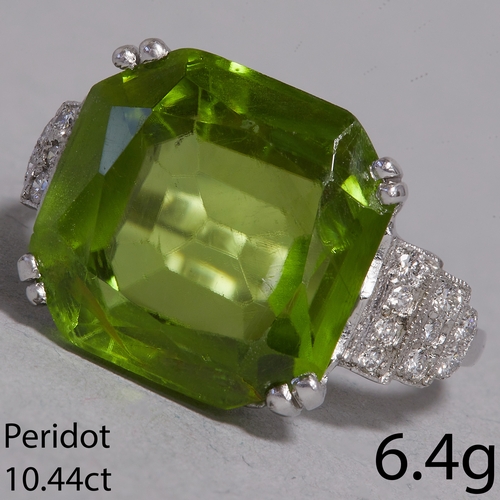 73 - PERIDOT AND DIAMOND RING,
6.4 grams, testing 18 ct. gold.
Rich and vibrant peridot with great clarit... 