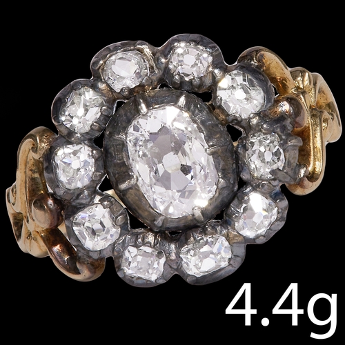 85 - GEORGIAN DIAMOND CLUSTER RING,
4.4 grams.
Bright and lively diamonds.
Center diamond of approx. 6.7 ... 