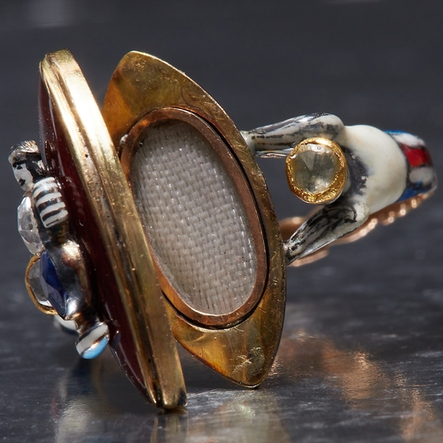 88 - RARE ANTIQUE GEORGIAN ENAMEL SAPPHIRE AND DIAMOND LOCKET RING,
4.1 grams, testing 18 ct. gold.
The m... 