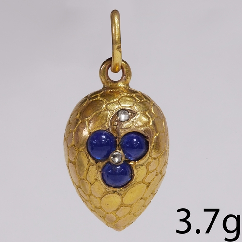 94 - SAPPHIRE AND DIAMOND EGG PENDANT, 
The egg of textured shell design, decorated with a flower 
Set wi... 