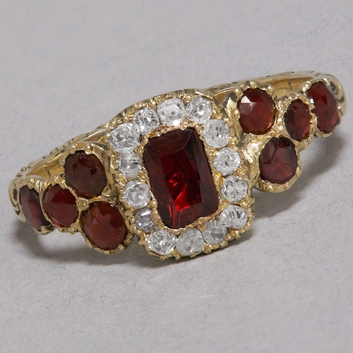 11 - VICTORIAN GARNET AND DIAMOND RING,
testing high carat gold.
Diamonds bright and lively.
Vibrant garn... 