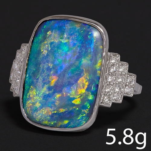 151 - LARGE OPAL AND DIAMOND RING,
5.8 grams, testing platinum.
Fine opal with good play of colour, includ... 