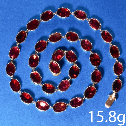 196 - ANTIQUE GARNET GOLD RIVIERE NECKLACE,
15.9 grams.
Each link with a foiled back garnet, well matched.... 