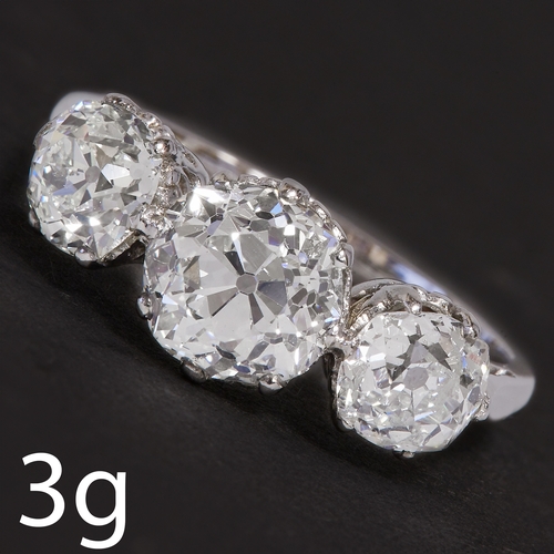 201 - A DIAMOND THREE STONE RING.
3 grams, high carat gold.
Diamonds bright and lively, totalling approx. ... 