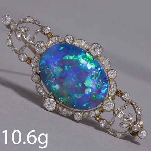 210 - BELLE EPOQUE LARGE OPAL AND DIAMOND BROOCH,
10.6 grams.
Large and vibrant opal with good play of col... 