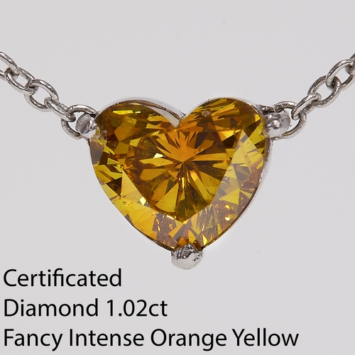 33 - CERTIFICATED FANCY INTENSE ORANGY YELLOW DIAMOND PENDANT NECKLACE, 
The heart shaped diamond of 1.02... 