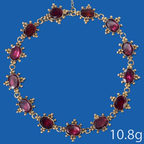 392 - VICTORIAN GARNET BRACELET. 
Set with rich vibrant garnets. within beaded surrounds.
L 18.5 cm. 
10.8... 