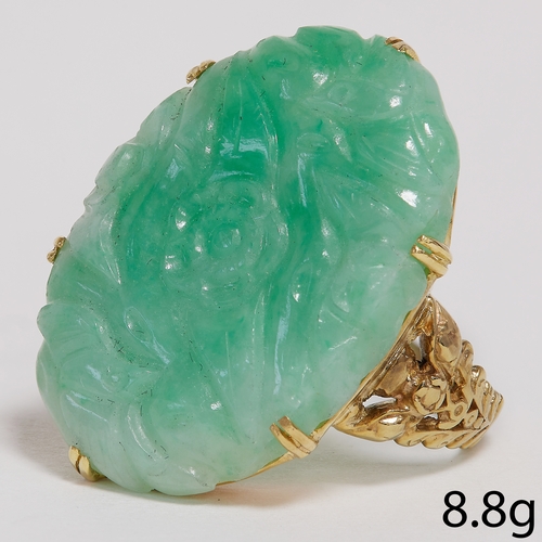 5 - CARVED JADE RING,
8.8 grams, testing high carat gold.
Fine carved green jade plaque of approx. 25.8 ... 