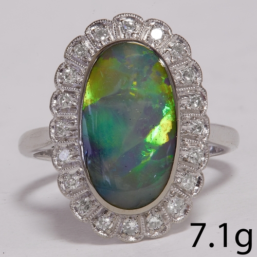 186 - OPAL AND DIAMOND CLUSTER RING,
7.1 grams, 18 ct. gold.
Opal of approx. 15 x 8.2 mm.
Diamonds bright ... 