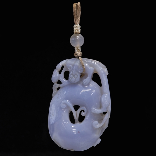 187 - CARVED LAVENDER JADE PENDANT,
25.8 grams.
Fine double sided carving with a dragon.
L. 7.6 cm.