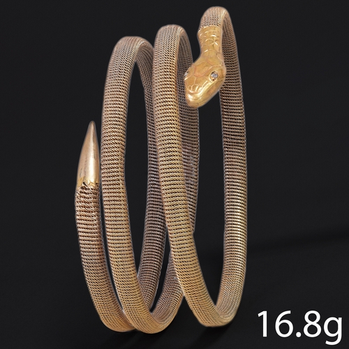 195 - 3-COIL SNAKE BANGLE WITH DIAMOND EYES.
16.8 grams,  High carat gold.
The bangle of fine woven link d... 