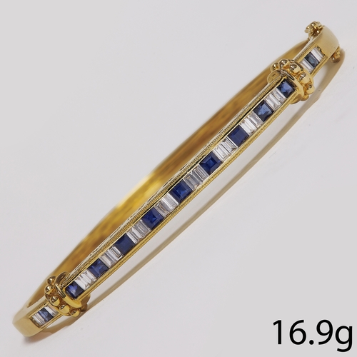 197 - SAPPHIRE AND DIAMOND BANGLE.
16.9 grams. Tested 18ct gold.
Set with vibrant  sapphires and bright di... 