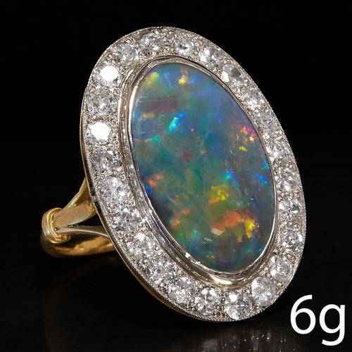 143 - BLACK OPAL AND DIAMOND CLUSTER RING,
6 grams, High carat gold.
Black opal with good play of colour i... 