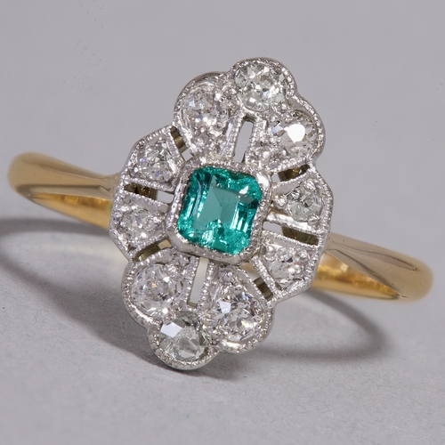 43 - EDWARDIAN EMERALD AND DIAMOND CLUSTER RING,
18 ct. gold and platinum.
Vibrant emerald.
Diamonds brig... 