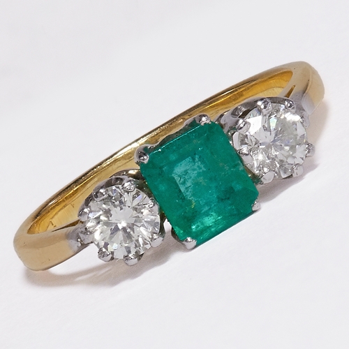 52 - EMERALD AND DIAMOND THREE STONE RING.
2.7 grams, Testing 18 ct. gold.
Gemstones totalling approx. 1 ... 