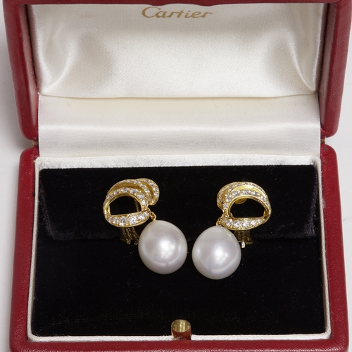 12 - CARTIER, PAIR OF PEARL AND DIAMOND EARRINGS,
14.3 grams, 18 ct. gold.
Large pearls of approx. 14.3 a... 