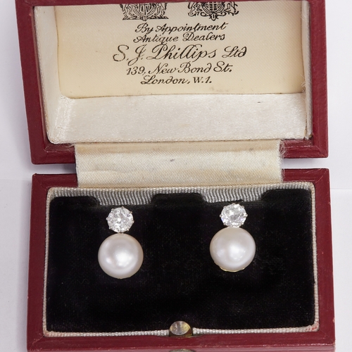 134 - CERTIFICATED NATURAL SALTWATER PEARL AND DIAMOND EARRINGS,
5.1 grams, testing 18 ct. gold.
The large... 