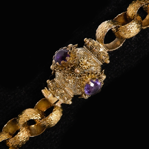 217 - FINE GEORGIAN LONG GUARD CHAIN WITH AMETHYST CLASP.
39.7 grams, testing high carat gold.
The links w... 