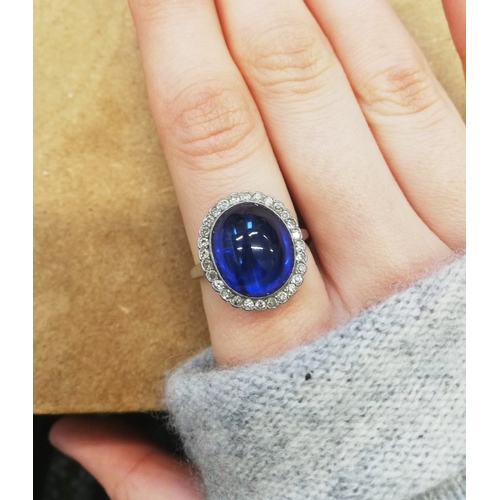 54 - CERTIFICATED 12.32 CT. BURMA SAPPHIRE AND DIAMOND CLUSTER RING, 
7.5 grams.
Rich and vibrant cabocho... 