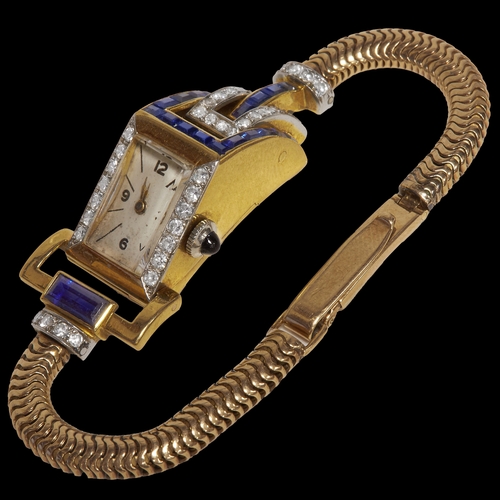 122 - UNUSUAL SAPPHIRE AND DIAMOND COCKTAIL WATCH,
31.5 grams, testing 18 ct. gold and gold strap.
Fine sa... 