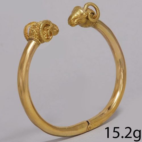 43 - ETRUSCAN REVIVAL DOUBLE RAMS HEAD BANGLE 
15.2 grams high carat gold 
fine craftsmanship 
inner diam... 