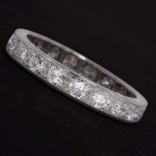 75 - DIAMOND ETERNITY RING,
testing high carat gold.
Diamonds totalling approx. 1.20 ct.
Engraved sides.
... 