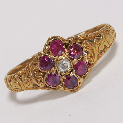 143 - ANTIQUE RUBY AND DIAMOND CLUSTER RING,
Testing high carat gold.
Size Q.