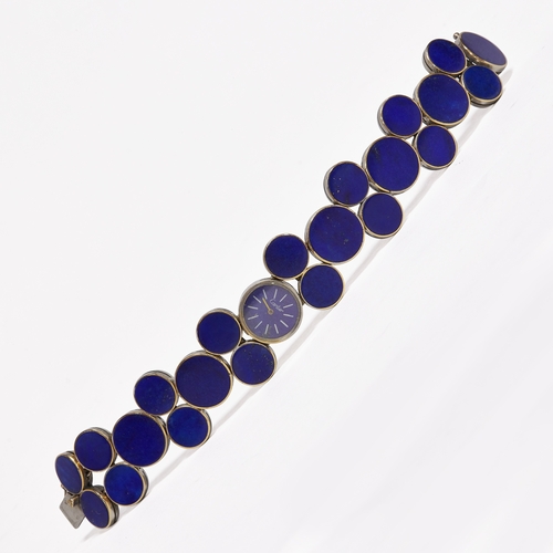 150 - CARTIER, ICONIC AND PROBABLY UNIQUE LAPIS LAZULI  WRIST WATCH,
54.6 grams, 18 ct. gold.
Fine lapis l... 