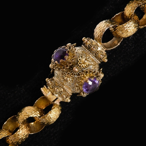 205 - FINE GEORGIAN LONG GUARD CHAIN WITH AMETHYST CLASP.
39.7 grams, testing high carat gold.
The links w... 