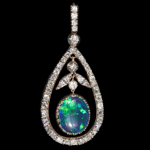 1 - FINE BLACK OPAL AND DIAMOND PENDANT. 
6.1 grams, 
Fine black opal with good play of colour, of appro... 