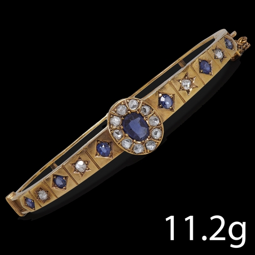 179 - VICTORIAN SAPPHIRE AND DIAMOND HINGED BANGLE,
11.2 grams, High carat gold.
Vibrant sapphires.
Diamon... 