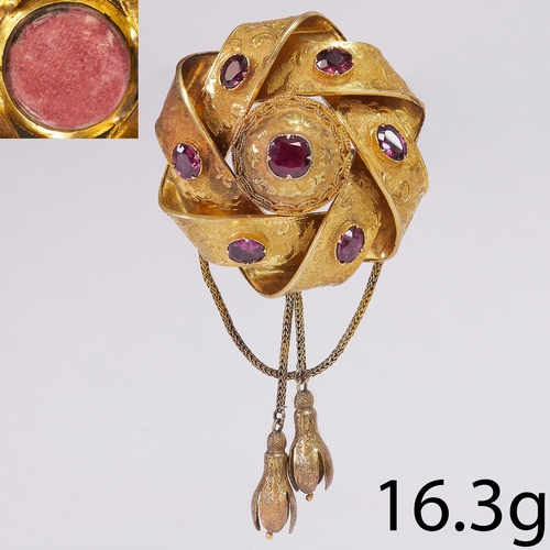 210 - VICTORIAN GARNET TASSLE BROOCH,
16.3 grams, testing 18 ct. gold.
Entwined design, set with vibrant w... 