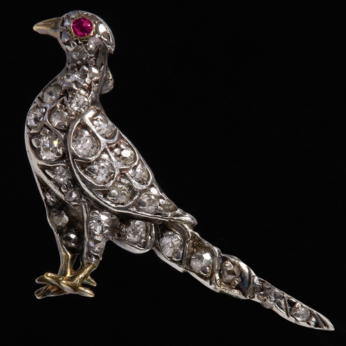 222 - VICTORIAN DIAMOND AND RUBY BIRD BROOCH, 
Likely a pheasant.
Diamonds bright and lively.
L. 3 cm.