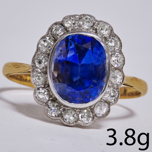 43 - SAPPHIRE AND DIAMOND CLUSTER RING,
3.8 grams, 18 ct. gold.
Vibrant sapphire of approx. 3.77 ct.
Diam... 